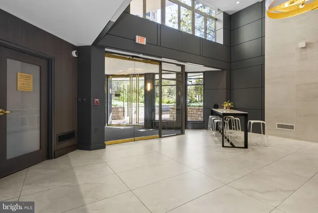 a picture of a bench in front of a white house