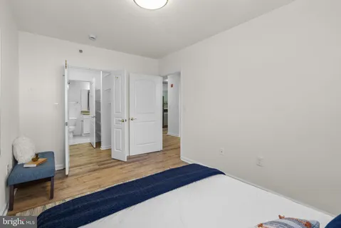 a bathroom with a granite countertop sink a toilet and bathtub