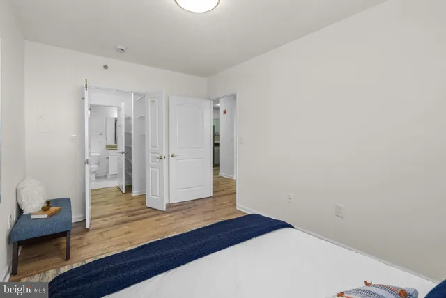 a bathroom with a granite countertop sink a toilet and bathtub