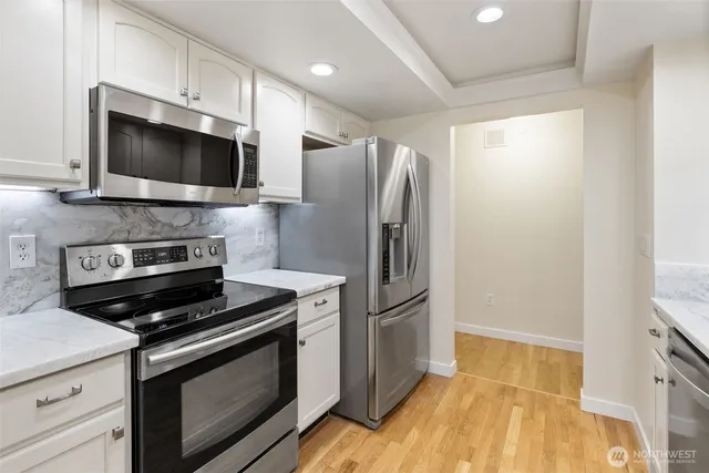 a kitchen with a stove microwave and refrigerator