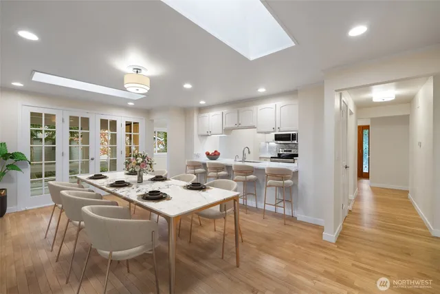 a kitchen with a table and chairs in it