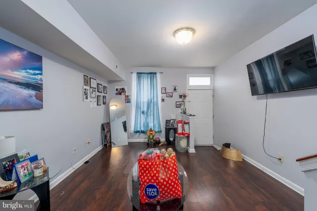 a bedroom with furniture and wooden floor