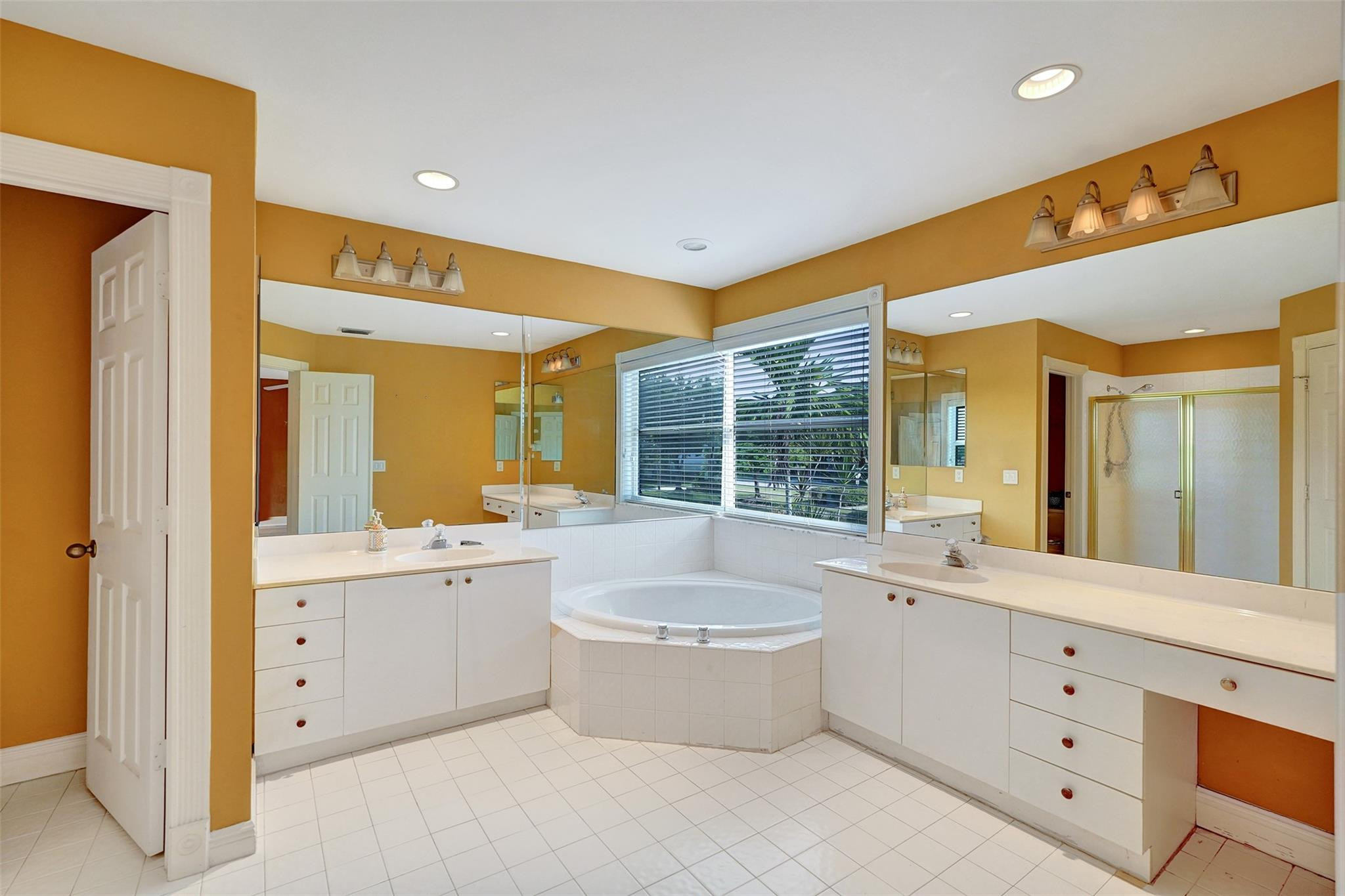 10902 Tamoron Lane Boca Raton, FL 33498 - Photo 35 of 66 a large spacious bathroom with a large tub shower and sink