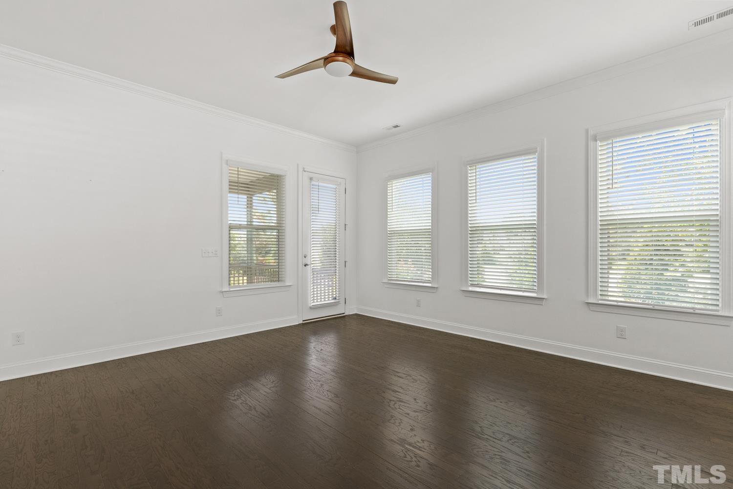 733 Midori Circle Cary, NC 27519 - Photo 13 of 41 a view of an empty room with wooden floor and a window