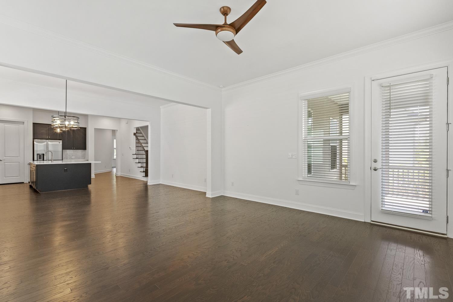 733 Midori Circle Cary, NC 27519 - Photo 14 of 41 a view of an empty room with a window and wooden floor