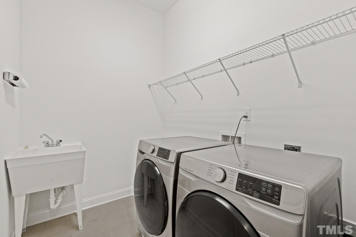733 Midori Circle Cary, NC 27519 - Photo 16 of 41 a utility room with dryer and washer
