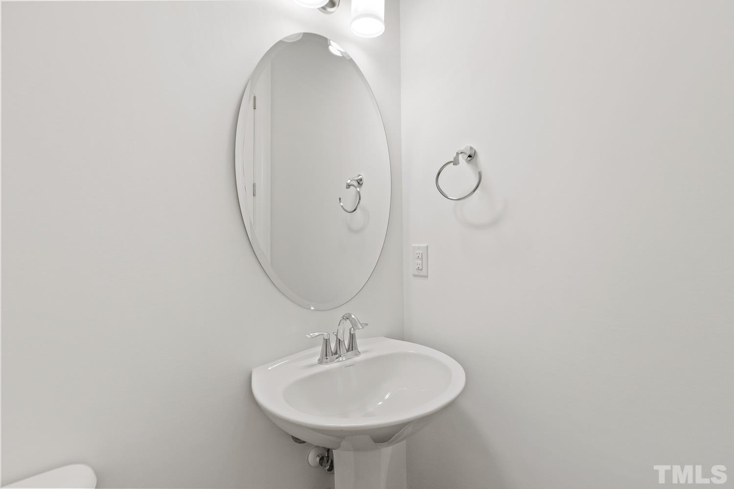 733 Midori Circle Cary, NC 27519 - Photo 17 of 41 a bathroom with a sink and mirror