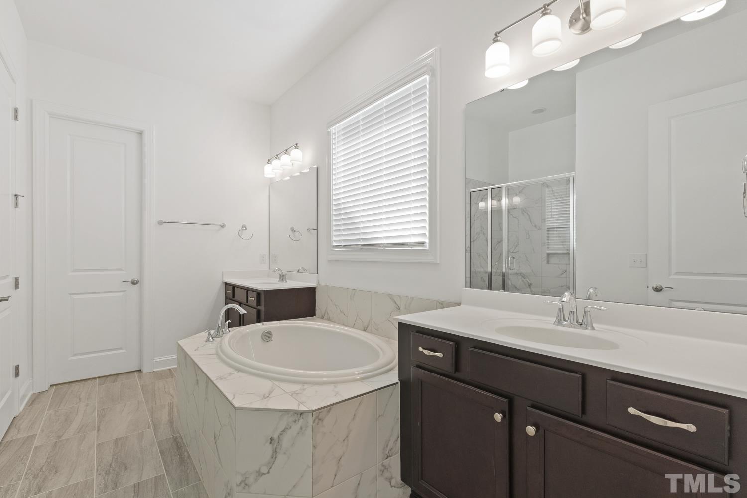 733 Midori Circle Cary, NC 27519 - Photo 23 of 41 a bathroom with a sink and a mirror