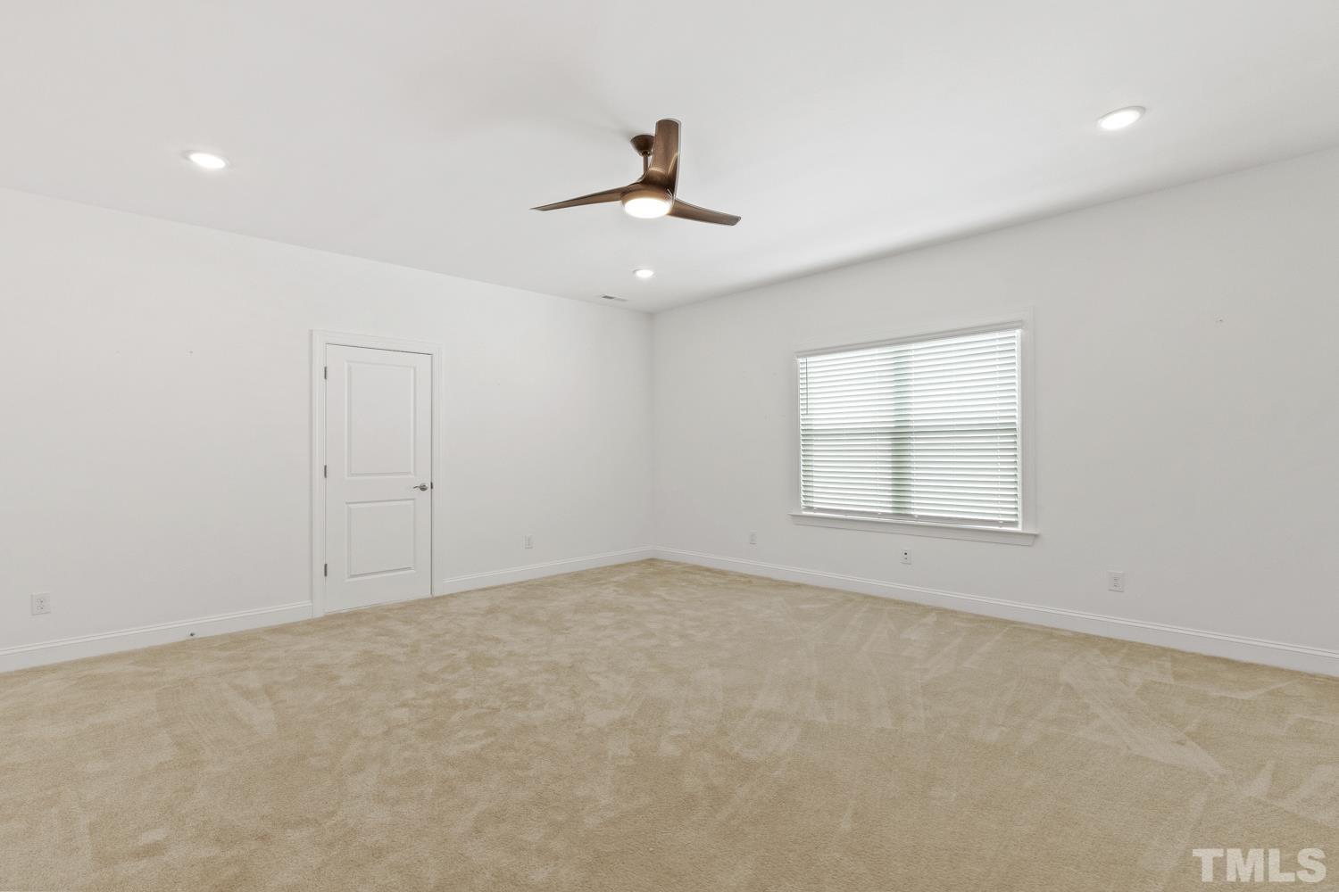 733 Midori Circle Cary, NC 27519 - Photo 30 of 41 an empty room with windows and fan