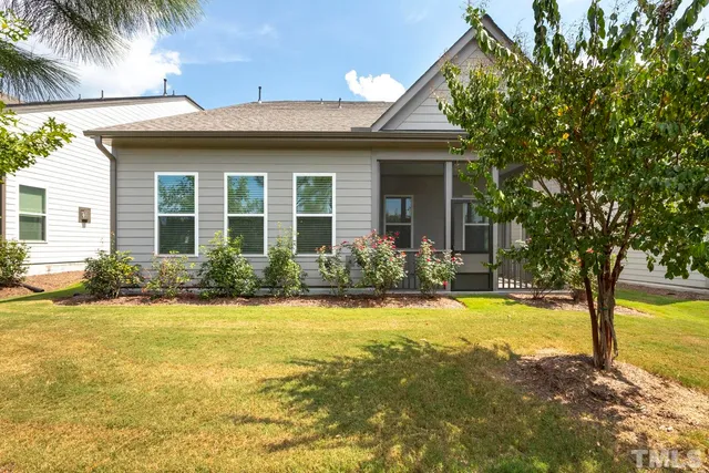 a view of a house with swimming pool and a porch