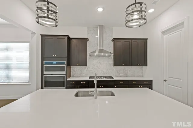a kitchen with a refrigerator and a sink