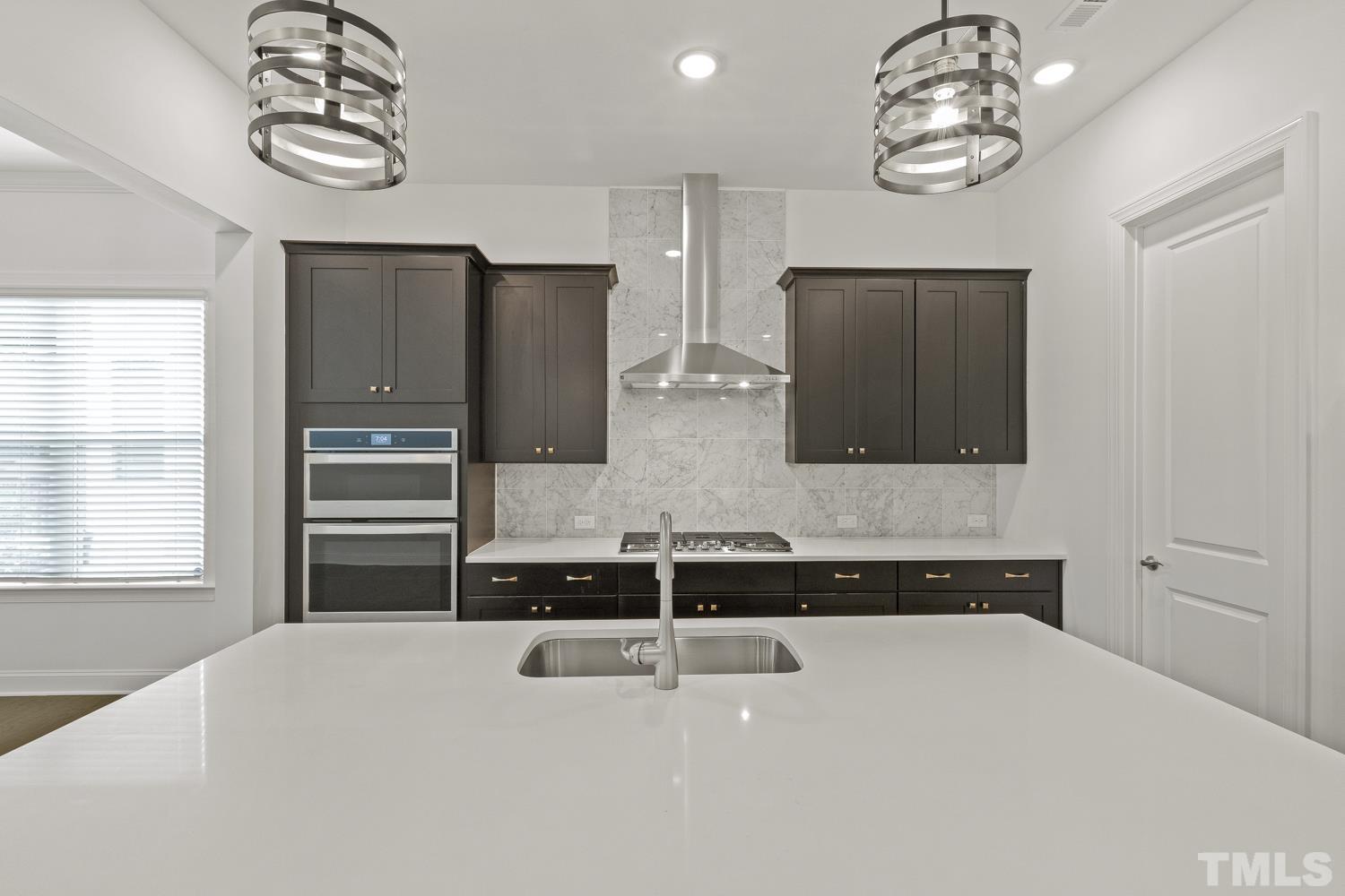 733 Midori Circle Cary, NC 27519 - Photo 10 of 41 a kitchen with a refrigerator and a sink