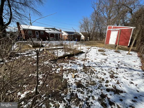 a view of a backyard of the house