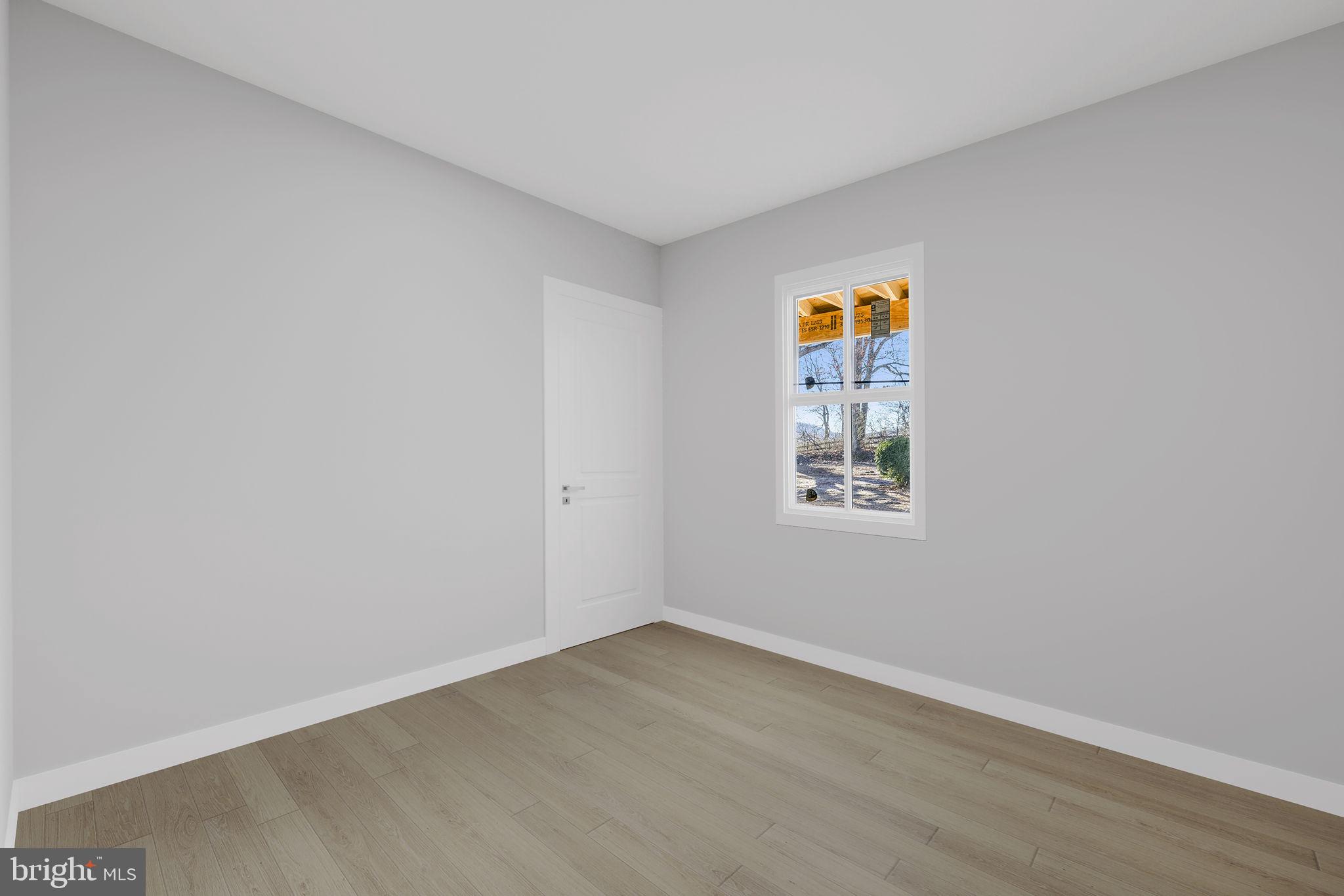 11066 Moreland Road Delaplane, VA 20144 - Photo 12 of 37 a view of an empty room with a window