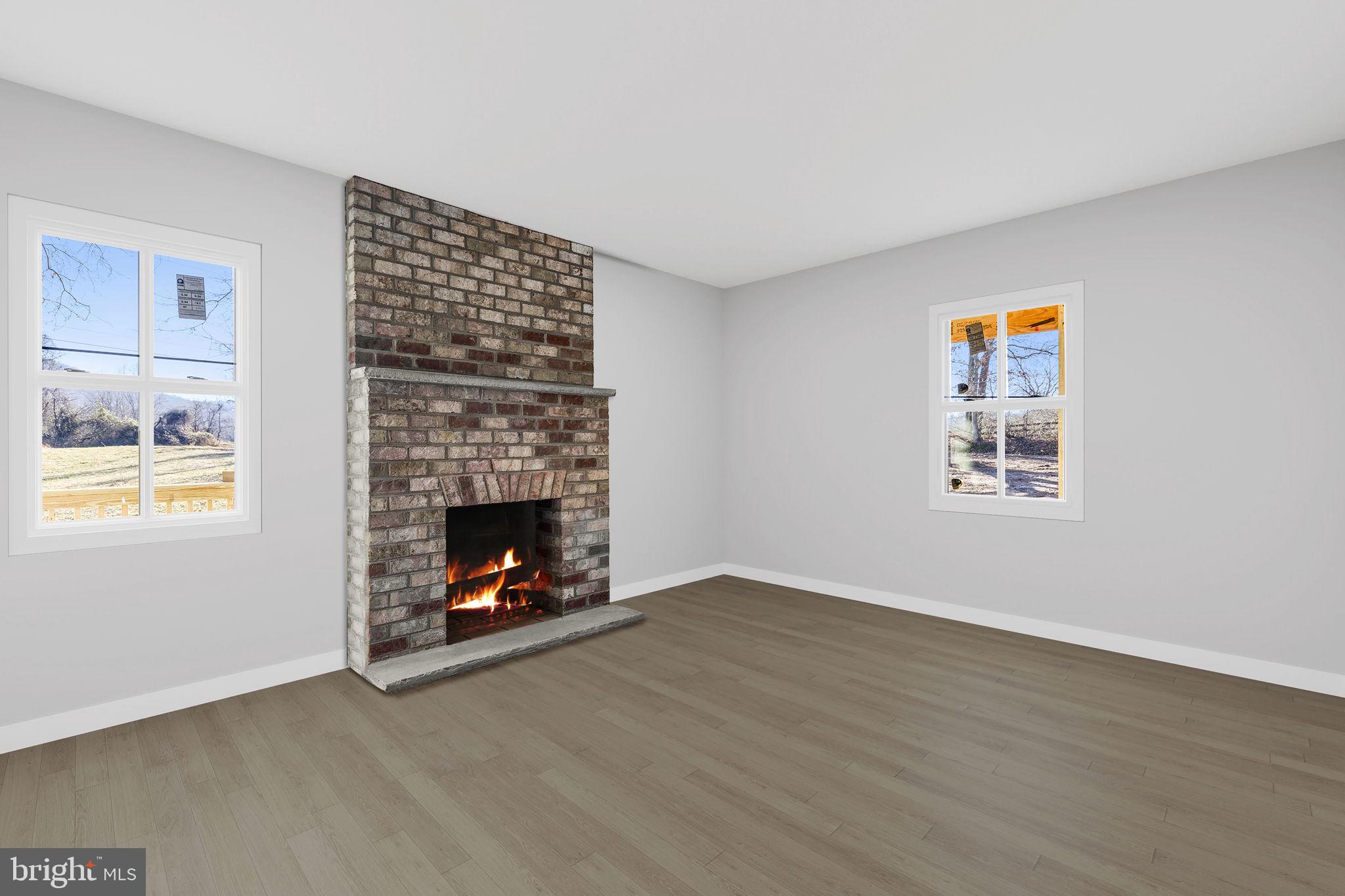 11066 Moreland Road Delaplane, VA 20144 - Photo 15 of 37 a living room with furniture and a fireplace