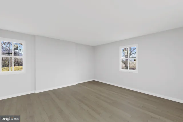 an empty room with windows