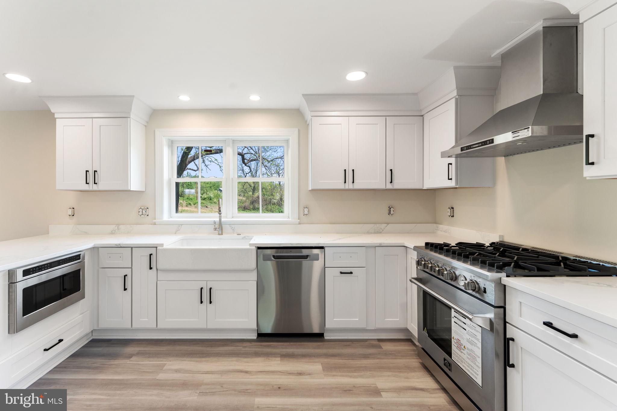11066 Moreland Road Delaplane, VA 20144 - Photo 24 of 87 a kitchen with stainless steel appliances granite countertop a stove a sink and a microwave