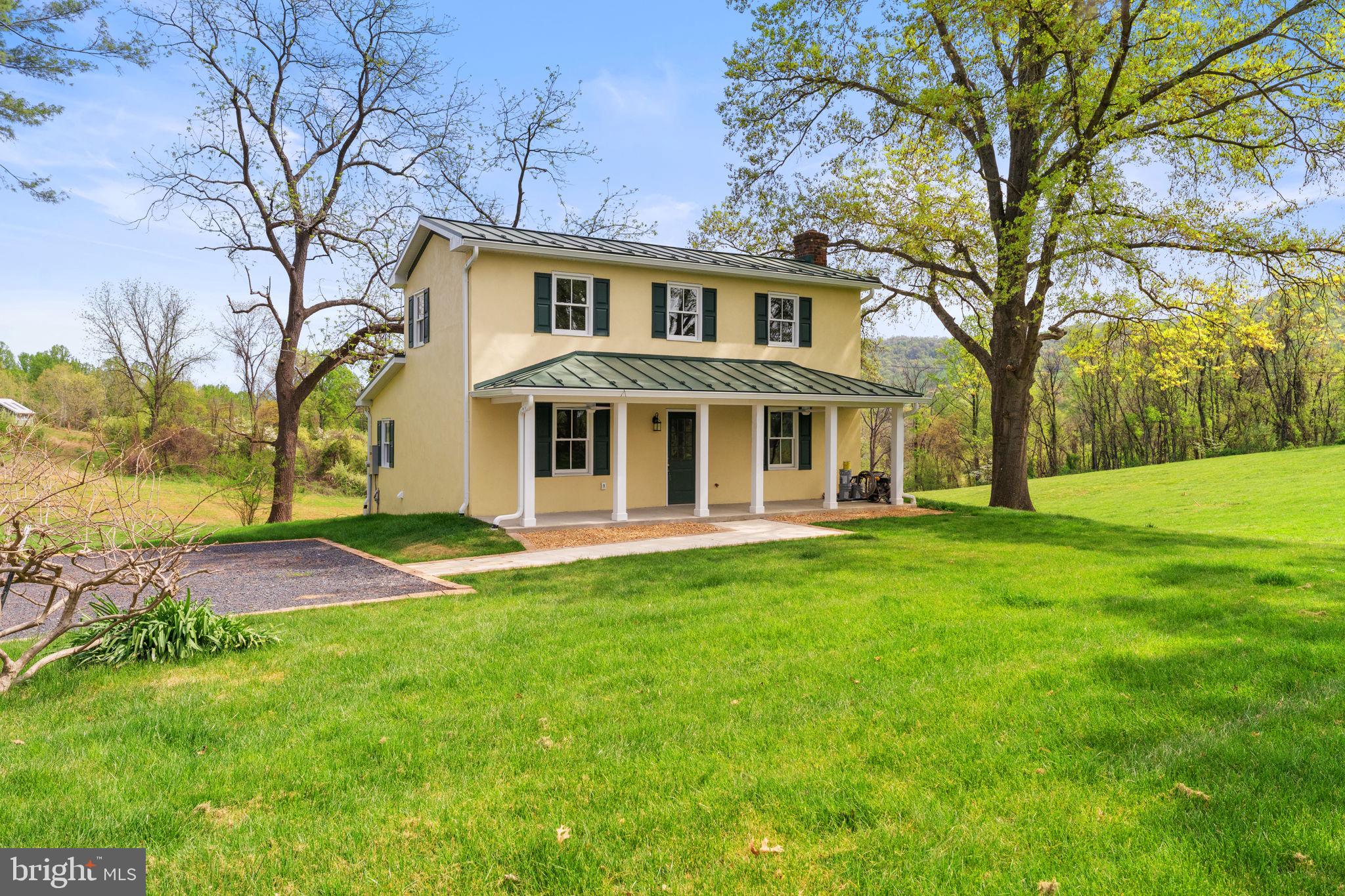 11066 Moreland Road Delaplane, VA 20144 - Photo 3 of 87 a front view of a house with a garden