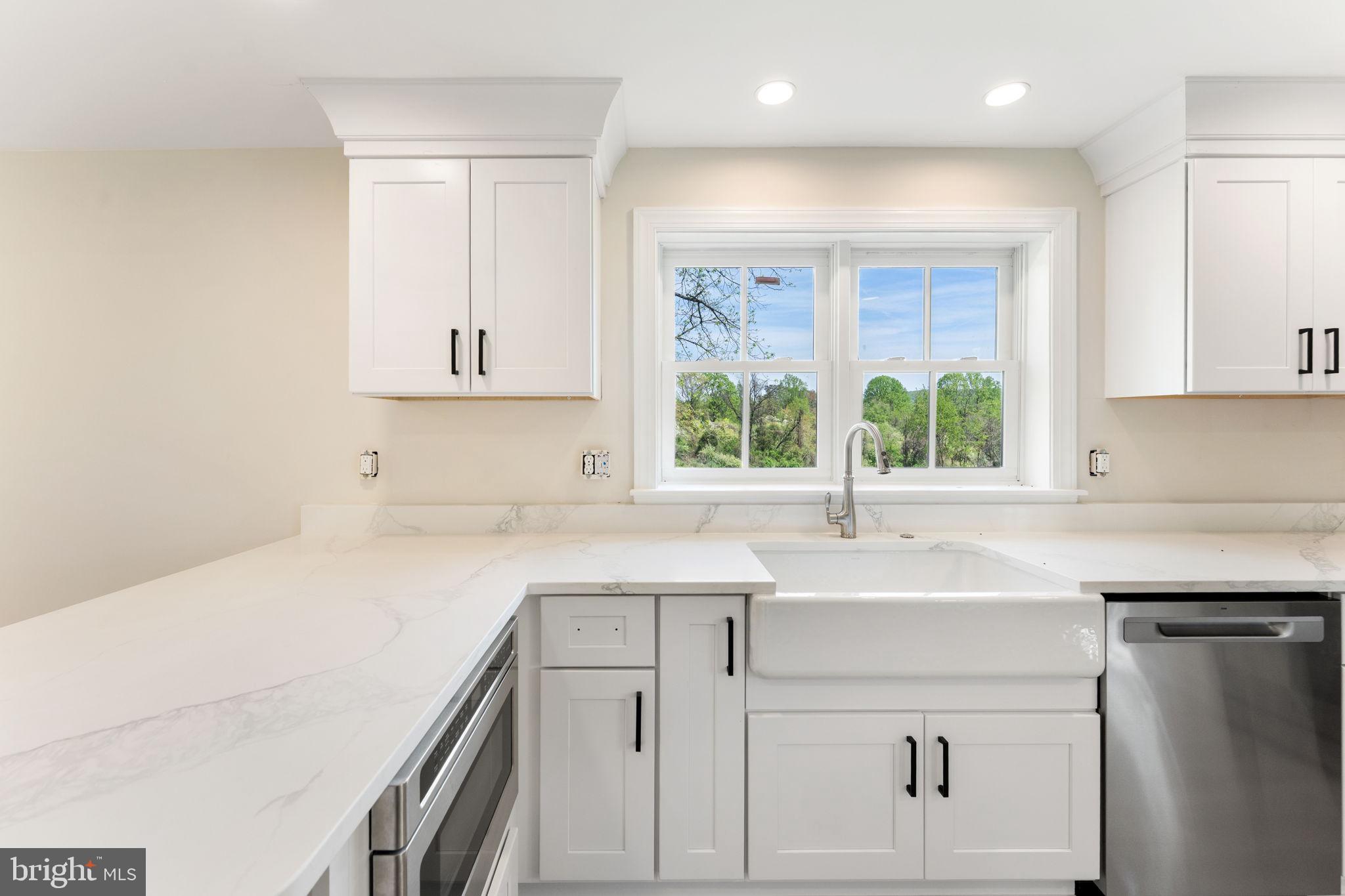 11066 Moreland Road Delaplane, VA 20144 - Photo 35 of 87 a kitchen with a sink cabinets and window