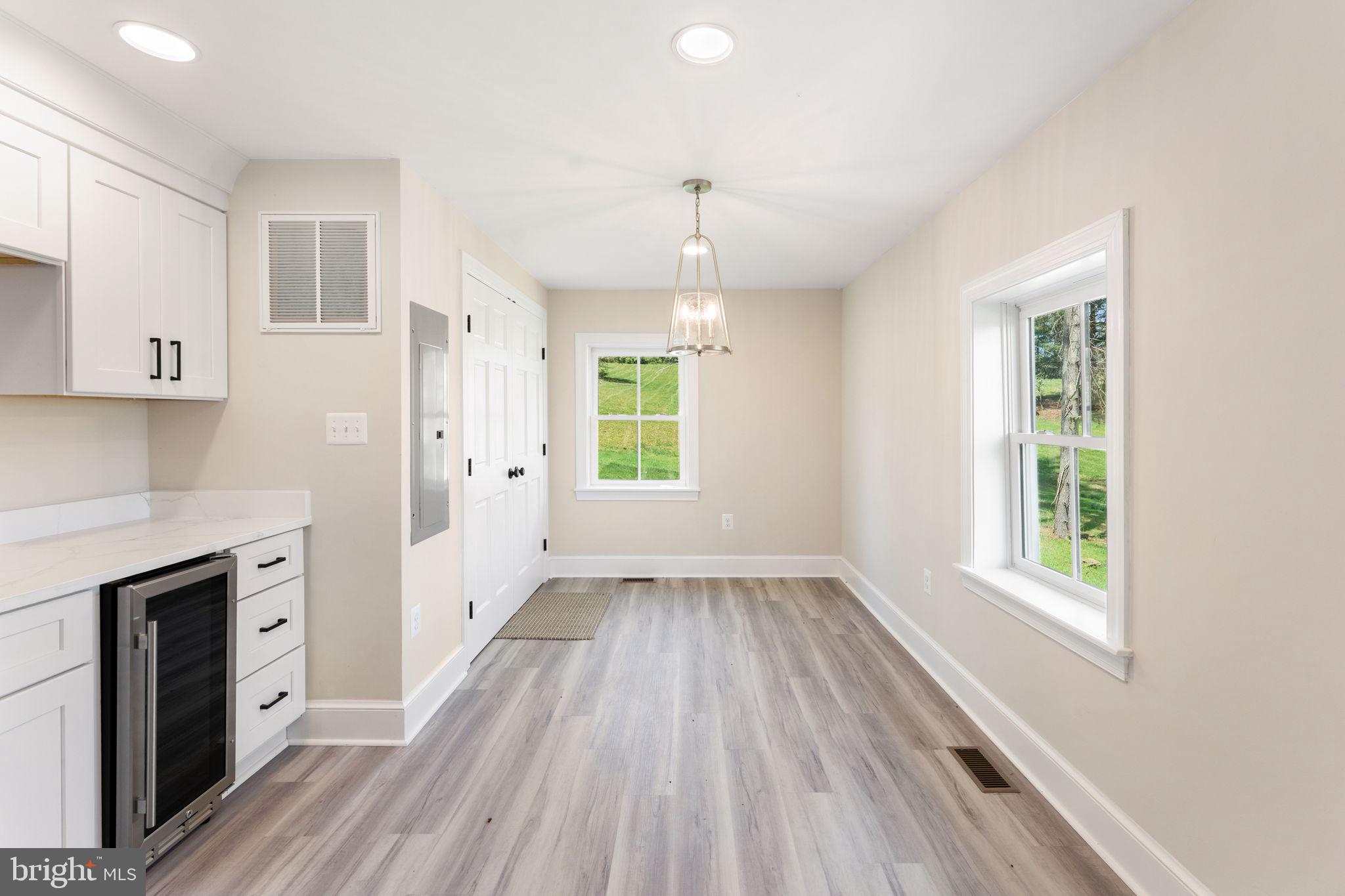 11066 Moreland Road Delaplane, VA 20144 - Photo 42 of 87 wooden floor in an empty room with a window