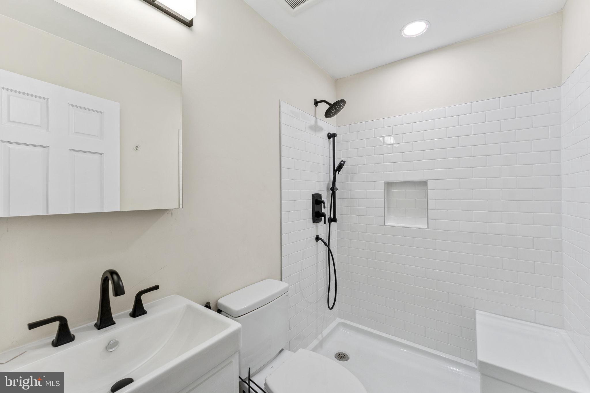 11066 Moreland Road Delaplane, VA 20144 - Photo 51 of 87 a bathroom with a sink toilet and shower