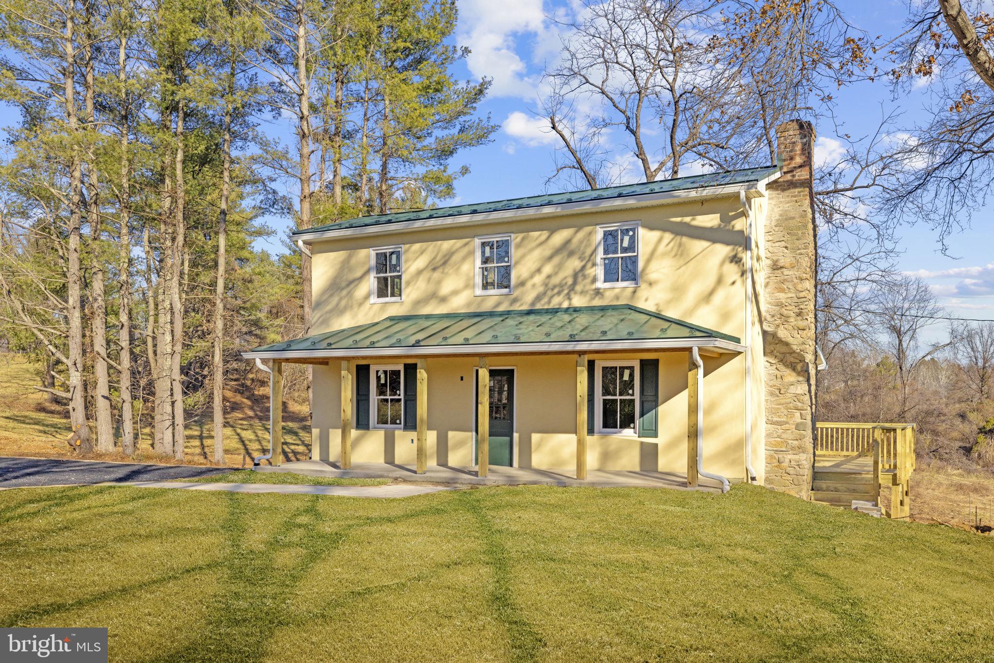 11066 Moreland Road Delaplane, VA 20144 - Photo 6 of 37 a front view of a house with swimming pool