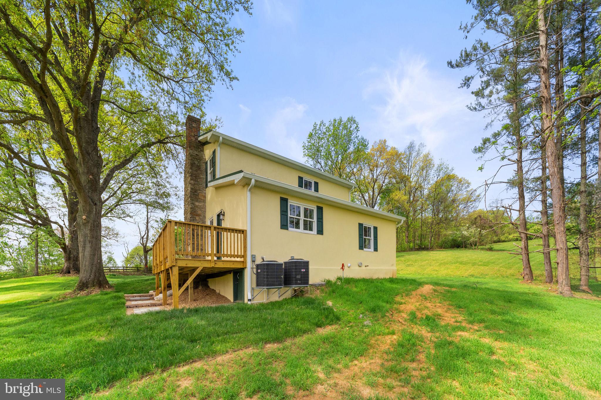 11066 Moreland Road Delaplane, VA 20144 - Photo 69 of 87 a backyard of a house with table and chairs