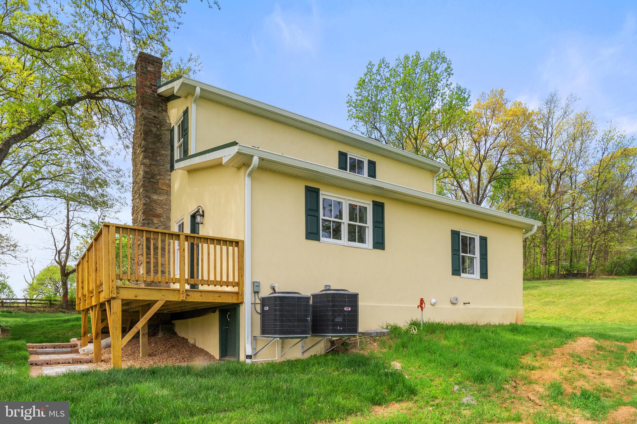 11066 Moreland Road Delaplane, VA 20144 - Photo 70 of 87 a view of backyard with a garden and deck