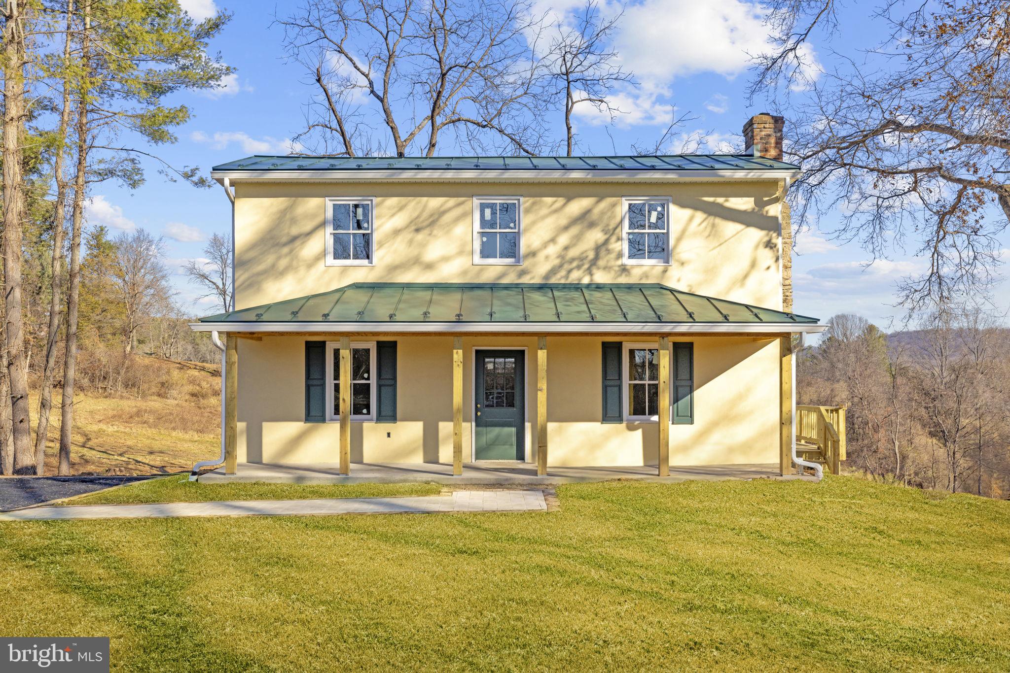 11066 Moreland Road Delaplane, VA 20144 - Photo 7 of 37 a view of a house with a swimming pool