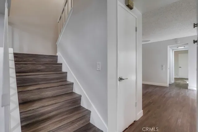 an empty room with wooden floor