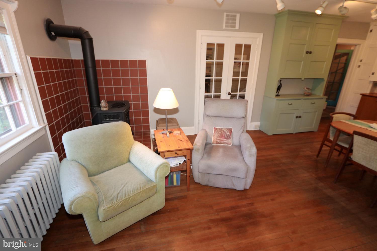 2701 Alden Road Bryn Athyn, PA 19006 - Photo 40 of 105 a living room with furniture a flat screen tv and a table
