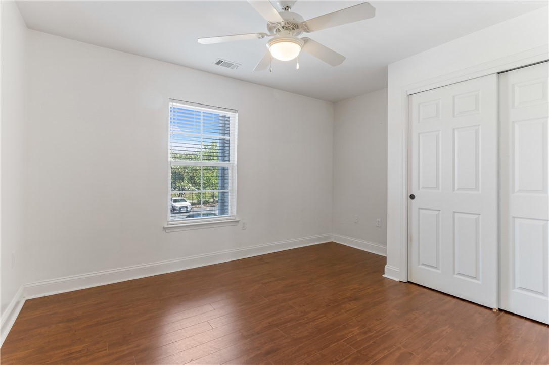 725 Lookover Drive Anderson, SC 29621 - Photo 18 of 31 Warm wood flooring pairs with clean white walls in this light-filled bedroom.