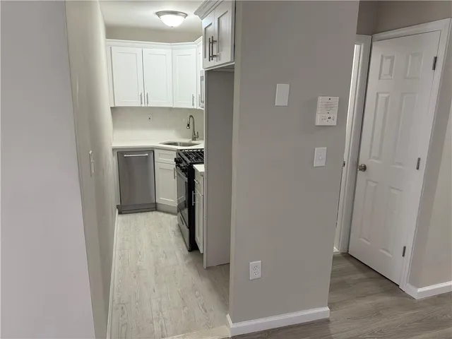 a view of a kitchen from the hallway