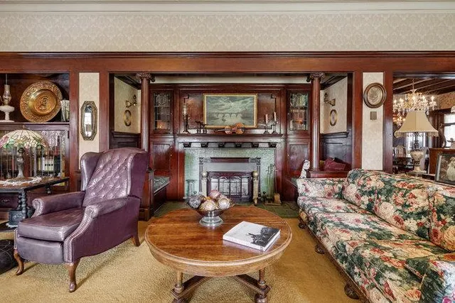 a living room with furniture and a fireplace