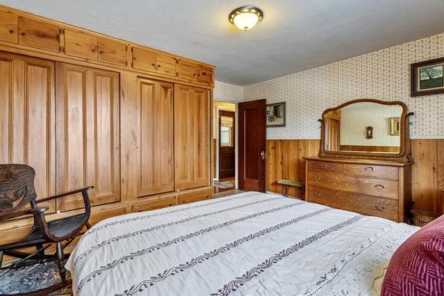 a bedroom with a bed and furniture