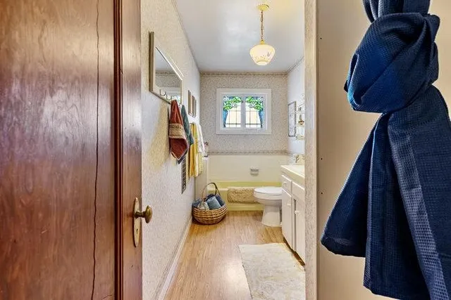 a bathroom with a sink and toilet