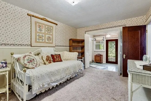 a living room with furniture and a balcony