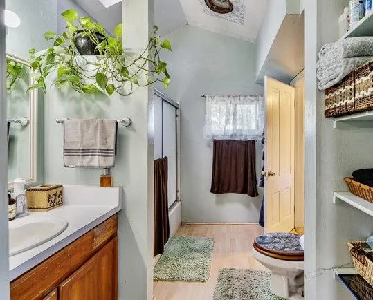 a room with pool table and windows