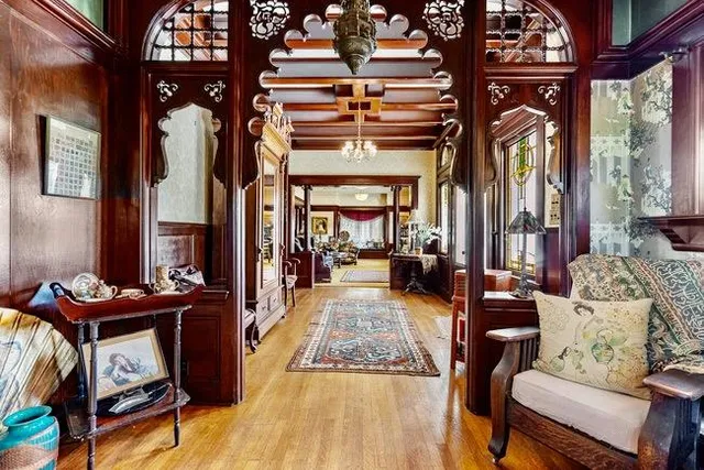 a living room with furniture a window and a chandelier