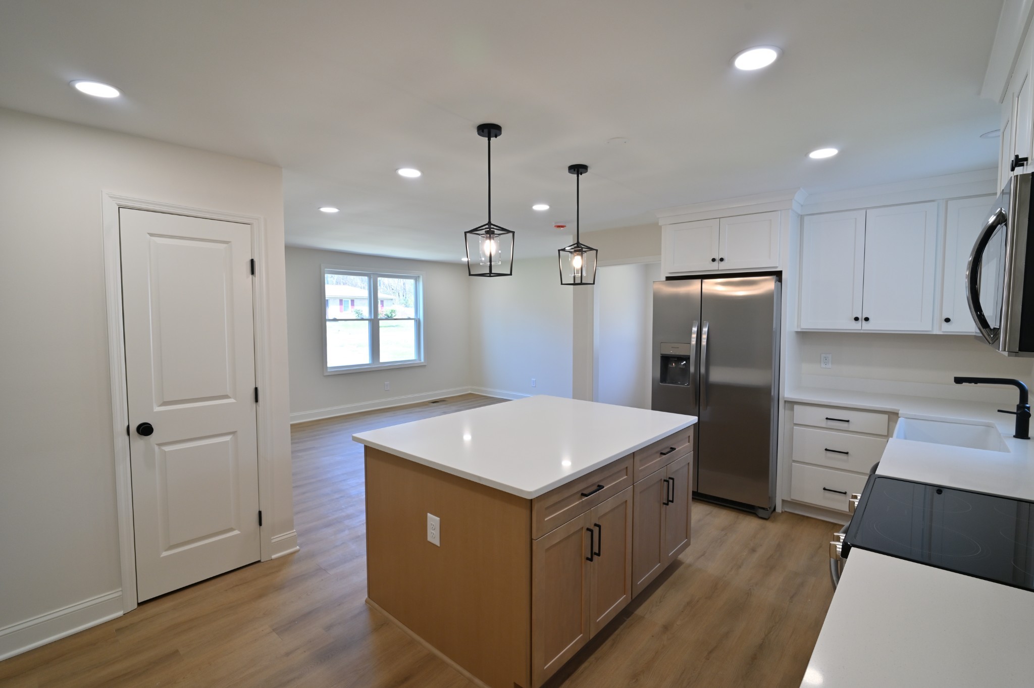 808 Hughes Street Spring Hill, TN 37174 - Photo 12 of 24 a kitchen that has a sink a refrigerator and window