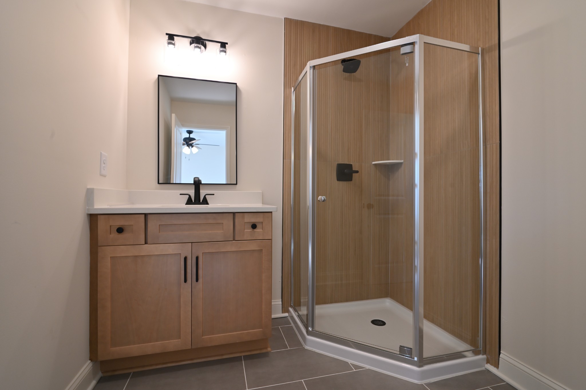 808 Hughes Street Spring Hill, TN 37174 - Photo 17 of 24 a bathroom with a shower sink and mirror
