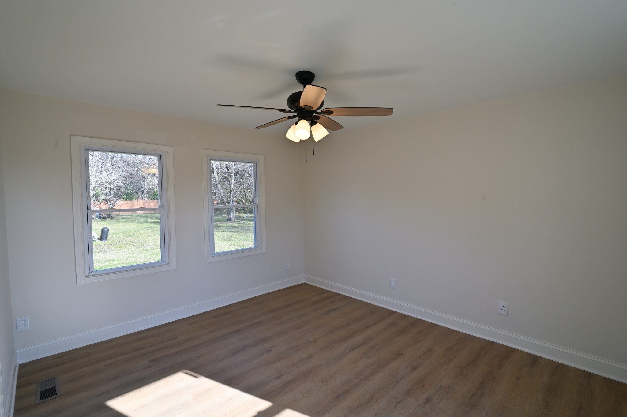 808 Hughes Street Spring Hill, TN 37174 - Photo 22 of 24 wooden floor in an empty room with a window