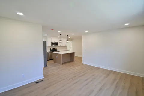 a view of kitchen with wooden floor