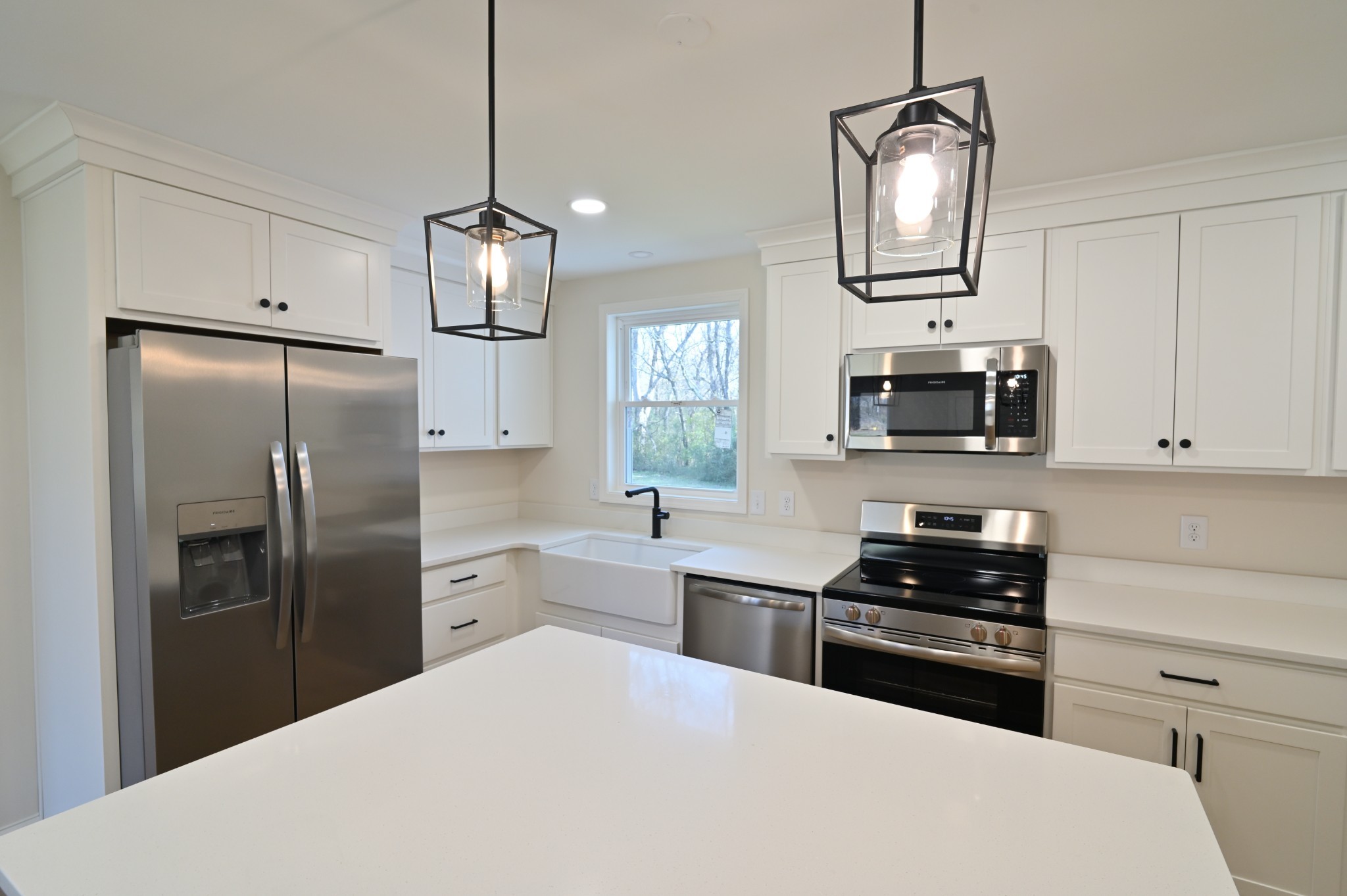 808 Hughes Street Spring Hill, TN 37174 - Photo 9 of 24 a kitchen with stainless steel appliances a refrigerator sink and stove