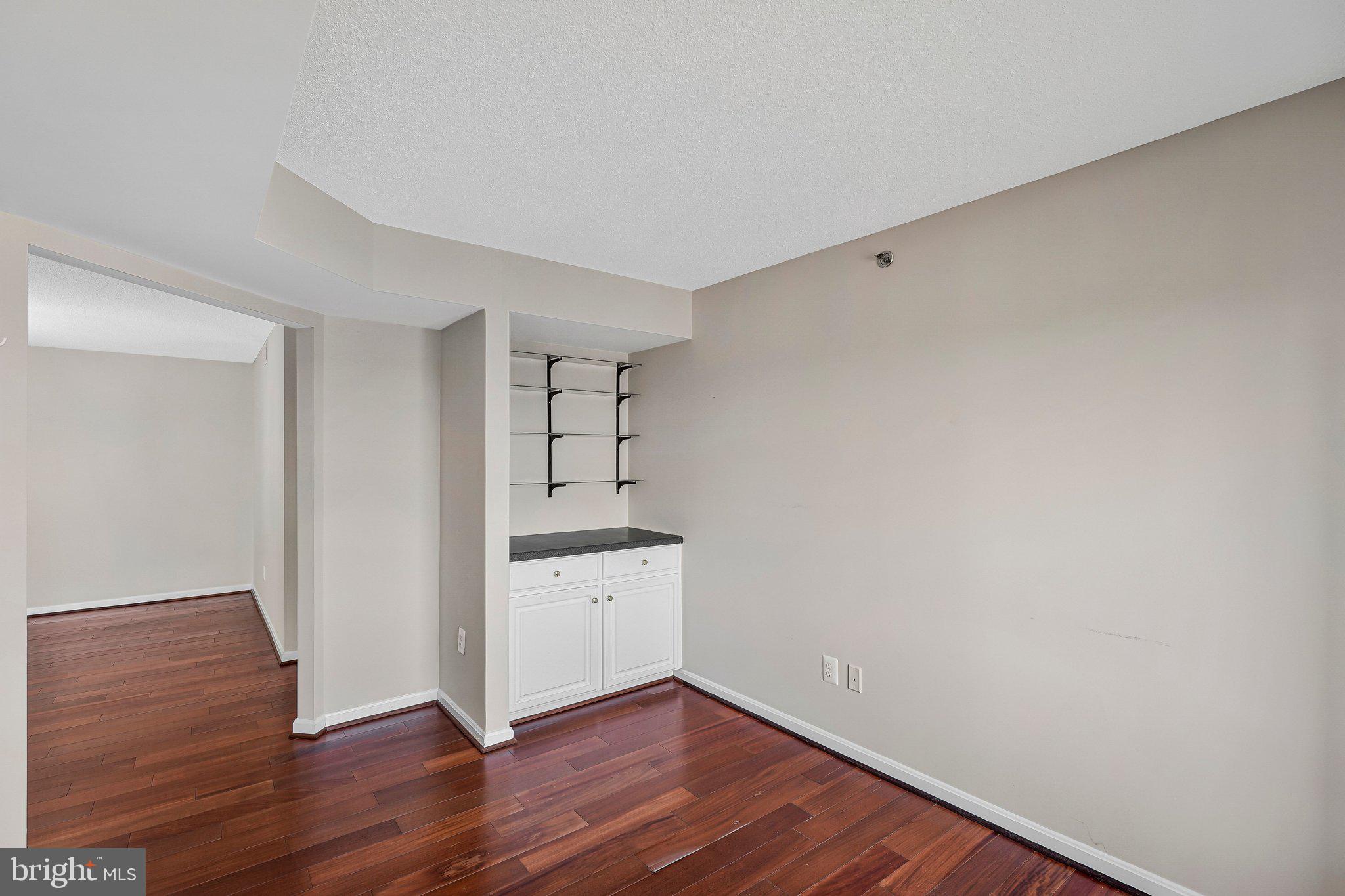 19385 Cypress Ridge Terrace, Unit 815 Leesburg, VA 20176 - Photo 13 of 35 a view of empty room with wooden floor
