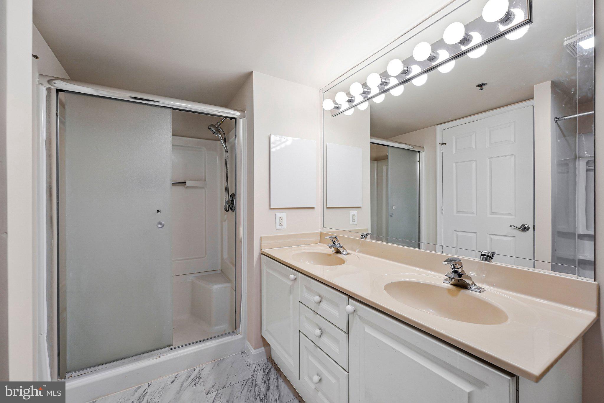 19385 Cypress Ridge Terrace, Unit 815 Leesburg, VA 20176 - Photo 18 of 35 a bathroom with a sink and a mirror