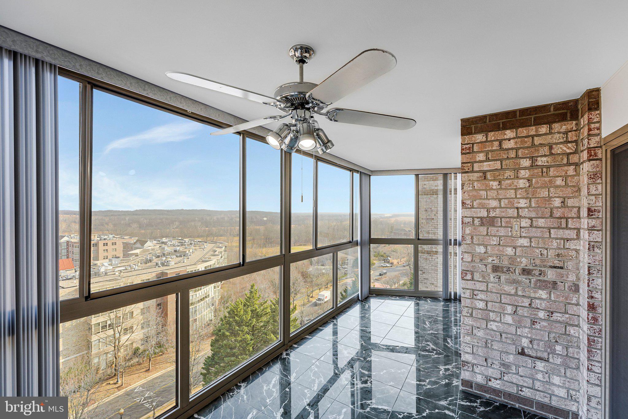 19385 Cypress Ridge Terrace, Unit 815 Leesburg, VA 20176 - Photo 27 of 35 a view of a glass door with a balcony