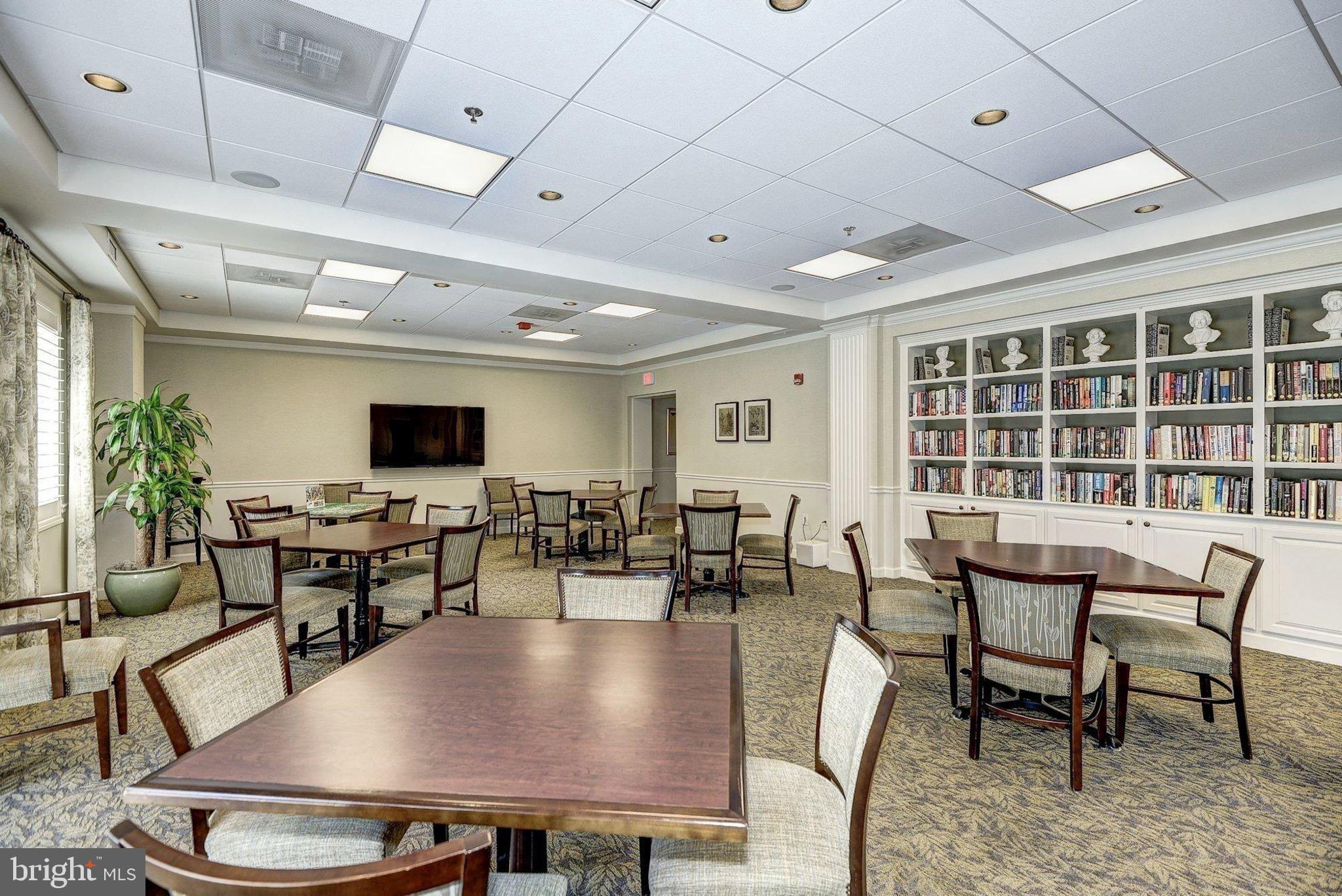 19385 Cypress Ridge Terrace, Unit 815 Leesburg, VA 20176 - Photo 30 of 35 a view of a dining room with furniture