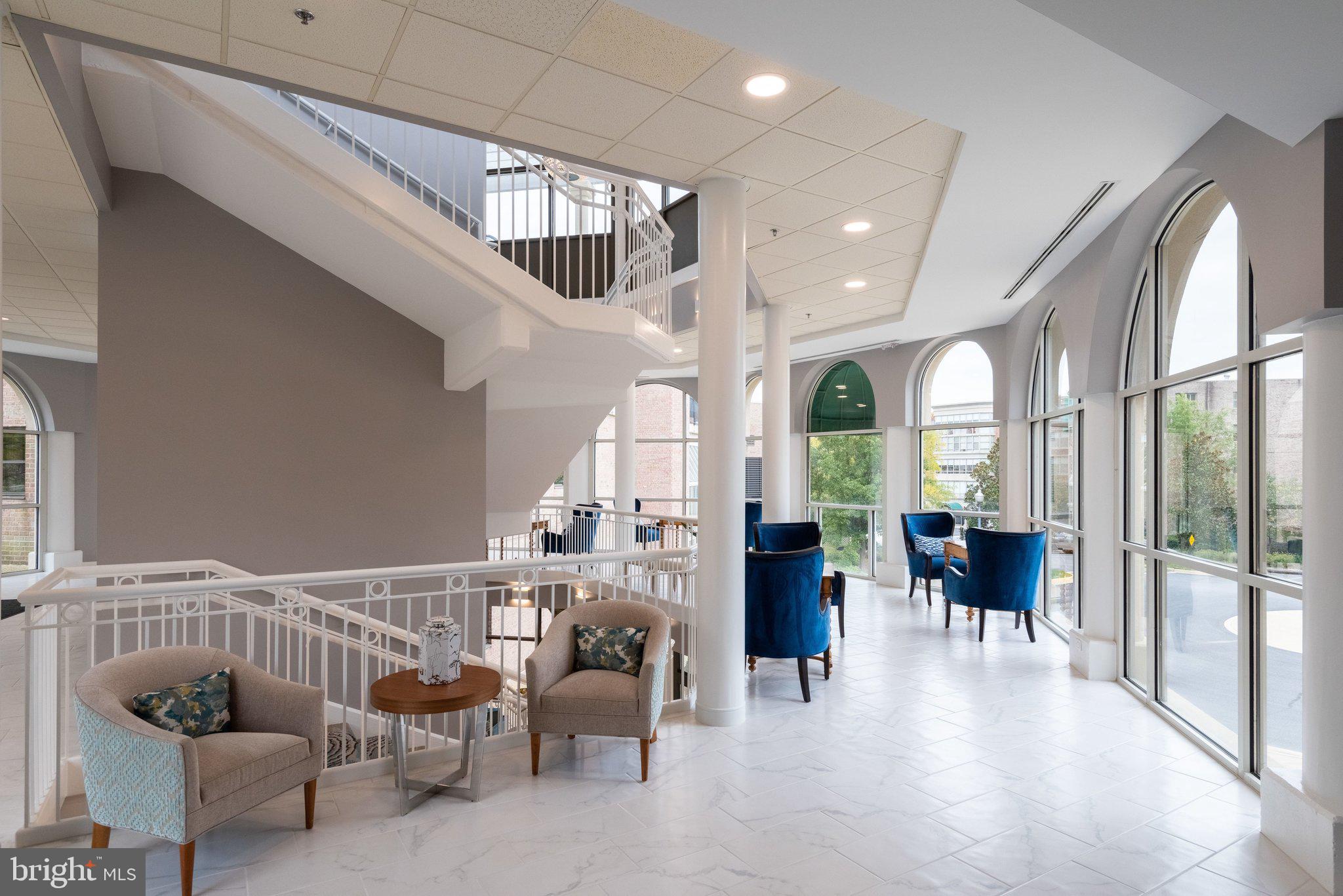 19385 Cypress Ridge Terrace, Unit 815 Leesburg, VA 20176 - Photo 33 of 35 a very nice looking living room with furniture and a large window