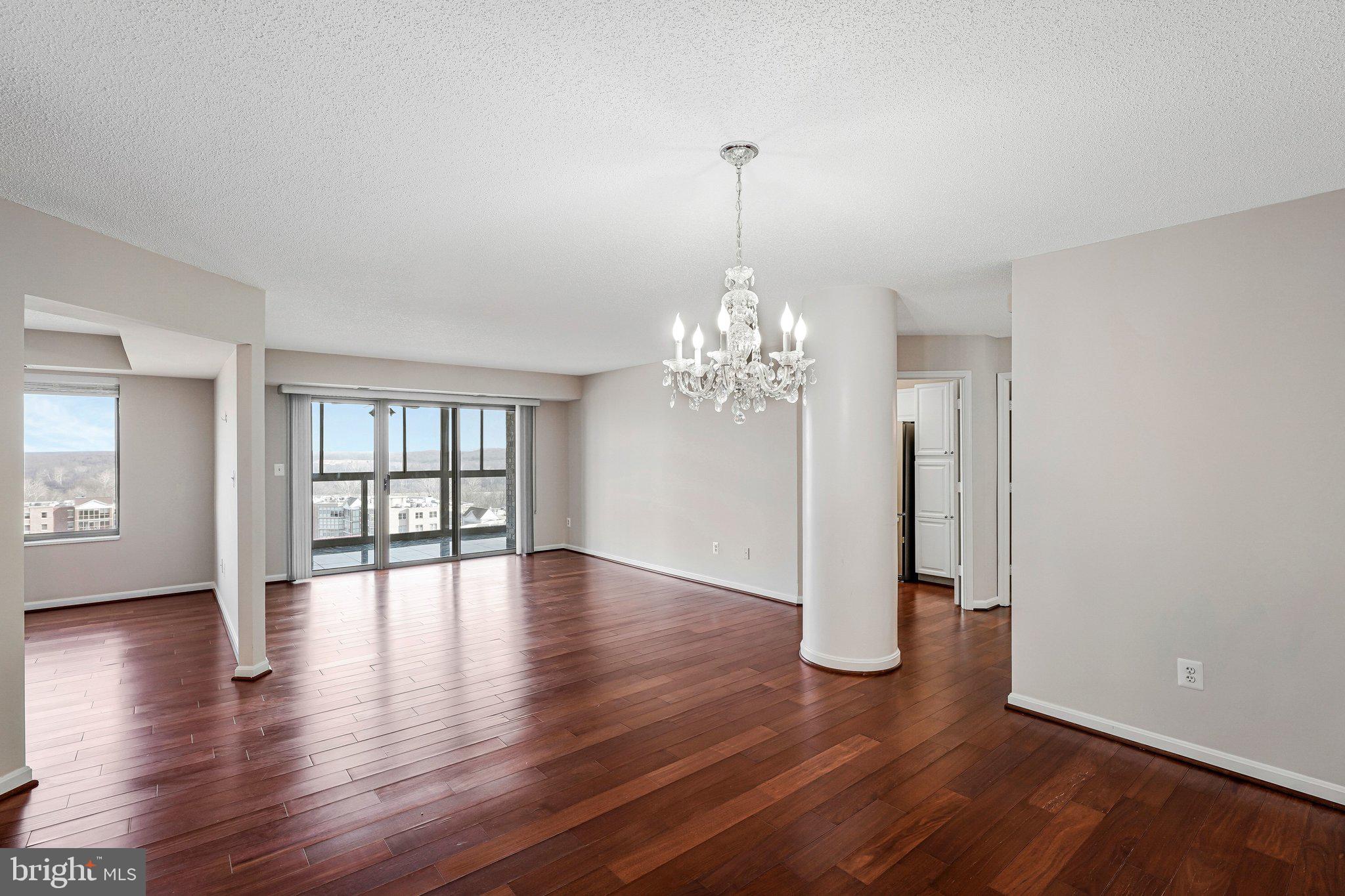 19385 Cypress Ridge Terrace, Unit 815 Leesburg, VA 20176 - Photo 6 of 35 a view of a livingroom with wooden floor